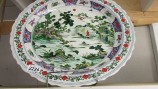 A large Chinese hand painted charger, 46 cm diameter.