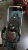 A Bosch battery lawn mower with battery and charger.