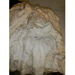 A large quantity of baby gowns etc.