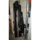 A quantity of fishing rods, cases etc.