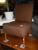 A vintage brown fabric nursing chair