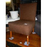 A vintage brown fabric nursing chair