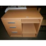 A modern teak-effect home fabricated office unit with drawers and shelves
