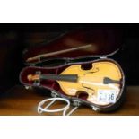 A cased miniature late 20th century violin.