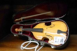 A cased miniature late 20th century violin.