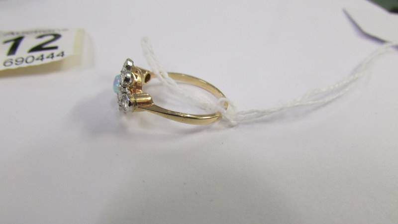 An 18ct gold ring set central opal surrounded by diamonds, size M. - Image 3 of 3