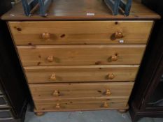 A modern pine 5 drawer bedroom chest of drawers