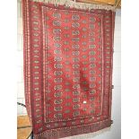 A 180 x 125 cm close woven rug.