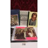 A mixed lot of movie related postcards and ephemera including singed facsimile cards of Gary Cooper,