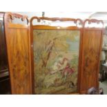 A superb mahogany three fold screen with tapestry centre.