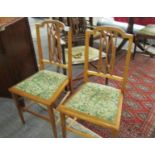 A pair of mahogany inlaid bedroom chairs.