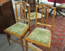 A pair of mahogany inlaid bedroom chairs.