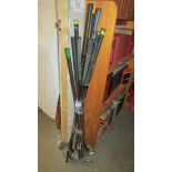 A quantity of golf clubs including Slazenger.