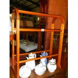 A stained wood towel rail