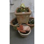 3 large terracotta pots and one other.