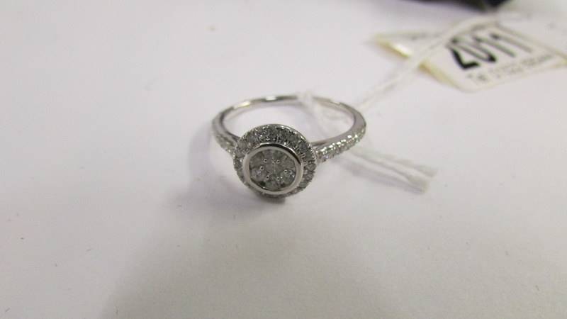 A white gold circular diamond ring of approximately half carat, size P. - Image 2 of 3