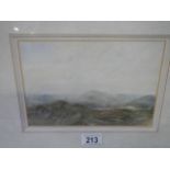 A good framed and glazed watercolour of hills (possibly Wales) signed Lauder, 40 x 34 cm.