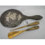 A silver hand mirror in good condition together with a silver handled button hook and a silver