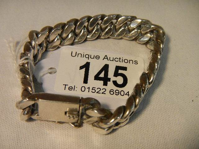 A good quality heavy kerb link silver bracelet, approximately 70 grams. - Image 3 of 3