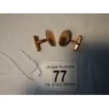 a pair of gold cuff links, marked 585, 10 grams.