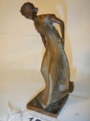 An art nouveau bronze figure of a lady signed Burger, 14 cm tall.