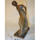 An art nouveau bronze figure of a lady signed Burger, 14 cm tall.
