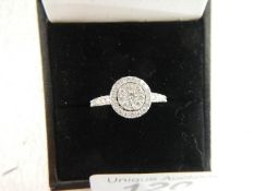 A 9ct white gold ring of separate carats ( half carat in total), weight 2.4 grams, size P.