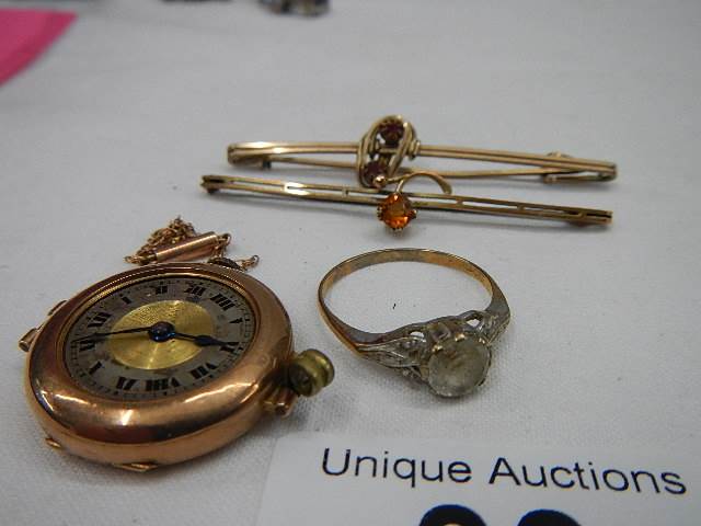 A 9ct gold ring size R Half, A gold ladies watch head, a small chain a/f and two brooches. - Image 5 of 5