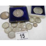 A quantity of silver coins and a Queen Elizabeth II £5 coin.