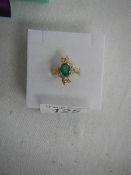 A 18ct yellow gold diamond and emerald ring (tests as 18ct), weight 4.8 grams, size O.