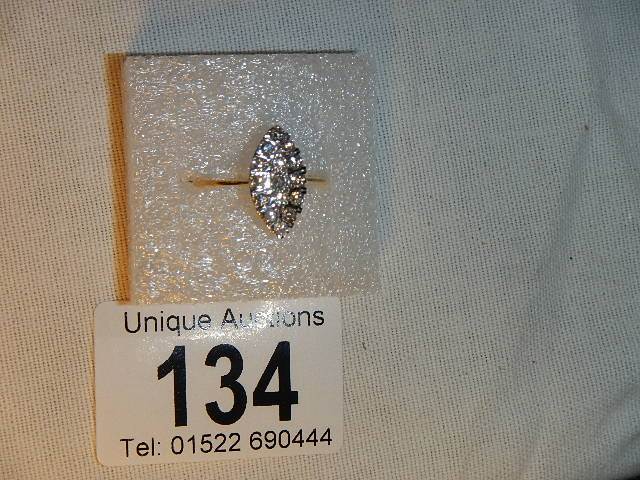 A marquis pattern 18ct yellow gold diamond ring (tests as 18ct), weight 3.3 grams, size L.