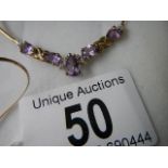 A 9ct gold necklace set amethyst. ****Condition report**** Marked 9ct, weight approx.