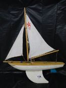 A good old pond yacht, 40 cm long to end of sail, 50 cm tall.