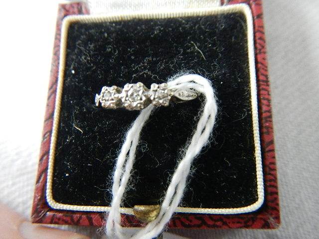 An 18ct gold and platinum three stone diamond ring, size K. - Image 2 of 3