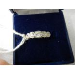 A five stone yellow gold diamond ring, size M.