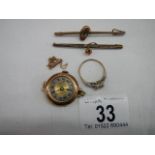 A 9ct gold ring size R Half, A gold ladies watch head, a small chain a/f and two brooches.