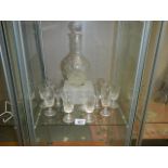 A cut glass decanter and 2 sets of 6 glasses.