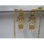 A pair of 22ct gold diamond and ruby earring with chains, 12 grams including stones.