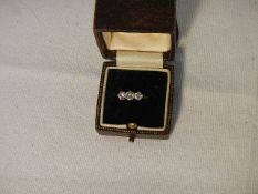 An 18ct yellow gold 3 stone 40 point diamond ring, weight 2.4 grams, size K.