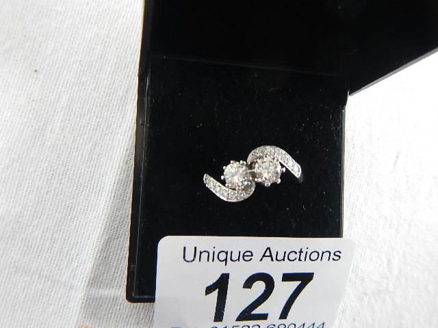 An 18ct white gold crossover diamond ring of 80pts, weight 4.4 grams, size N. - Image 2 of 6