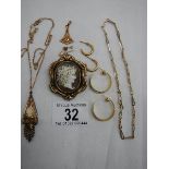 A quantity of gold coloured items including pendant, swivel cameo brooch etc.