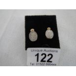 A pair of yellow gold oval earring sets diamonds, weight 2.g grams.