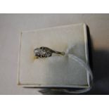 An 18ct gold 3 stone diamond ring, size M.