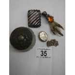 A mixed lot of silver items including silver vesta, silver topped jar, silver claw brooch etc.