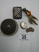 A mixed lot of silver items including silver vesta, silver topped jar, silver claw brooch etc.