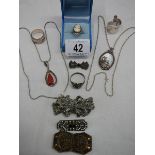 A mixed lot of jewellery including mother of pearl pendant, marcasite brooches,
