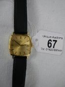 An 18ct gold gent's Omega wrist watch, in working order,.