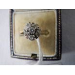 A circa 1960/70's cluster ring set with 6 diamonds, stamped 18ct and platinum, size ).