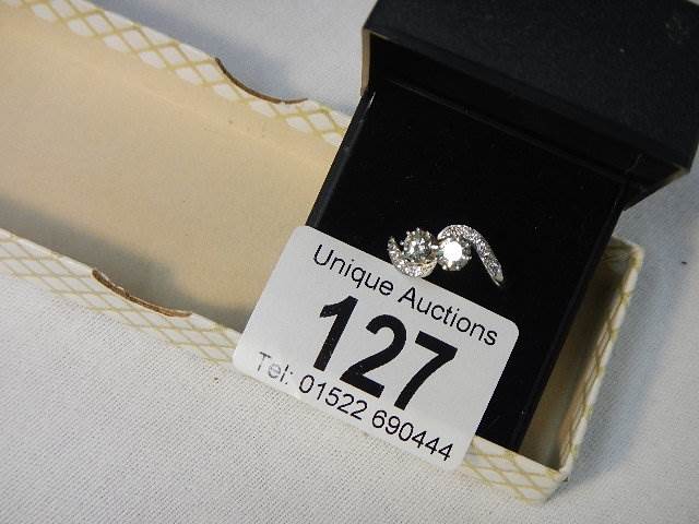 An 18ct white gold crossover diamond ring of 80pts, weight 4.4 grams, size N. - Image 4 of 6