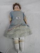 An early 20th century bisque headed doll with moveable joints (1 thumb a/f), model No.